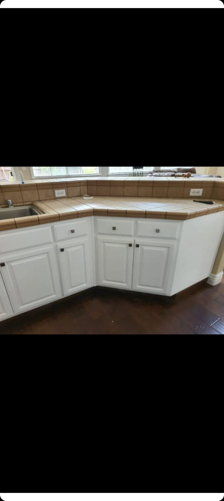 White corner cabinets with stone counters